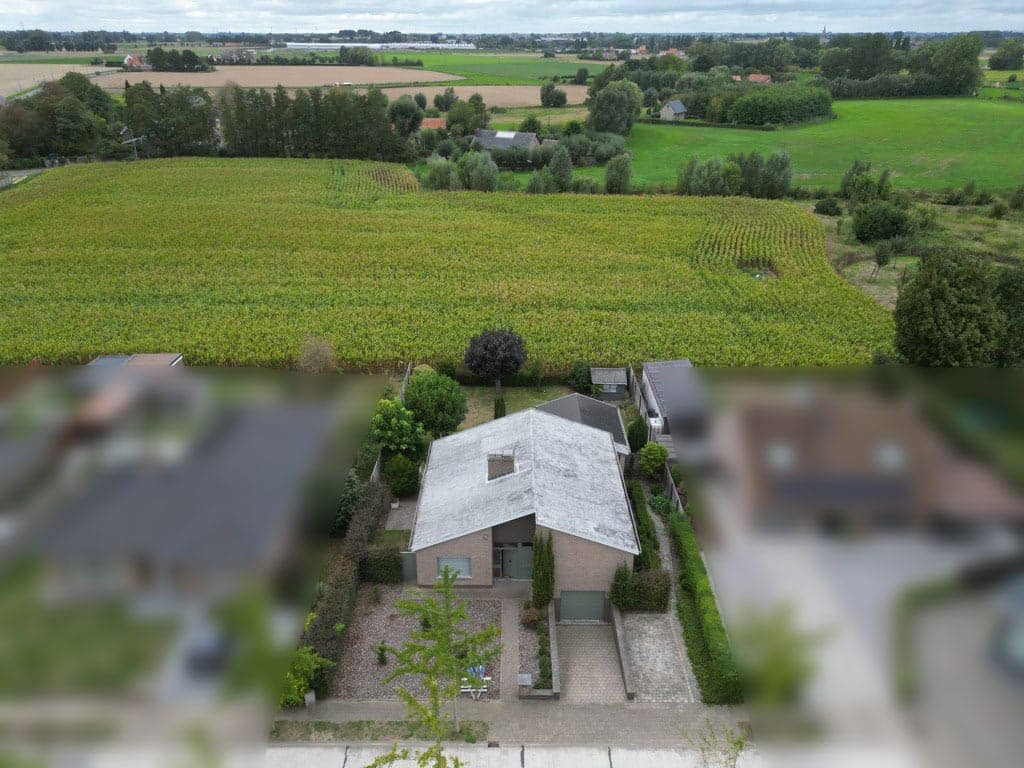 Woning tussen de velden, van bovenaf, met de buren vervaagd